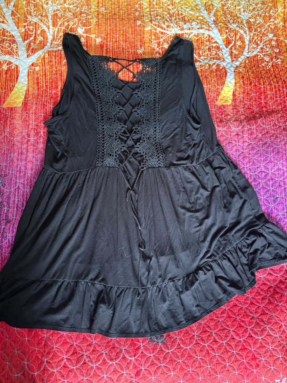 Black Lace-Up Sleeveless Peplum Top